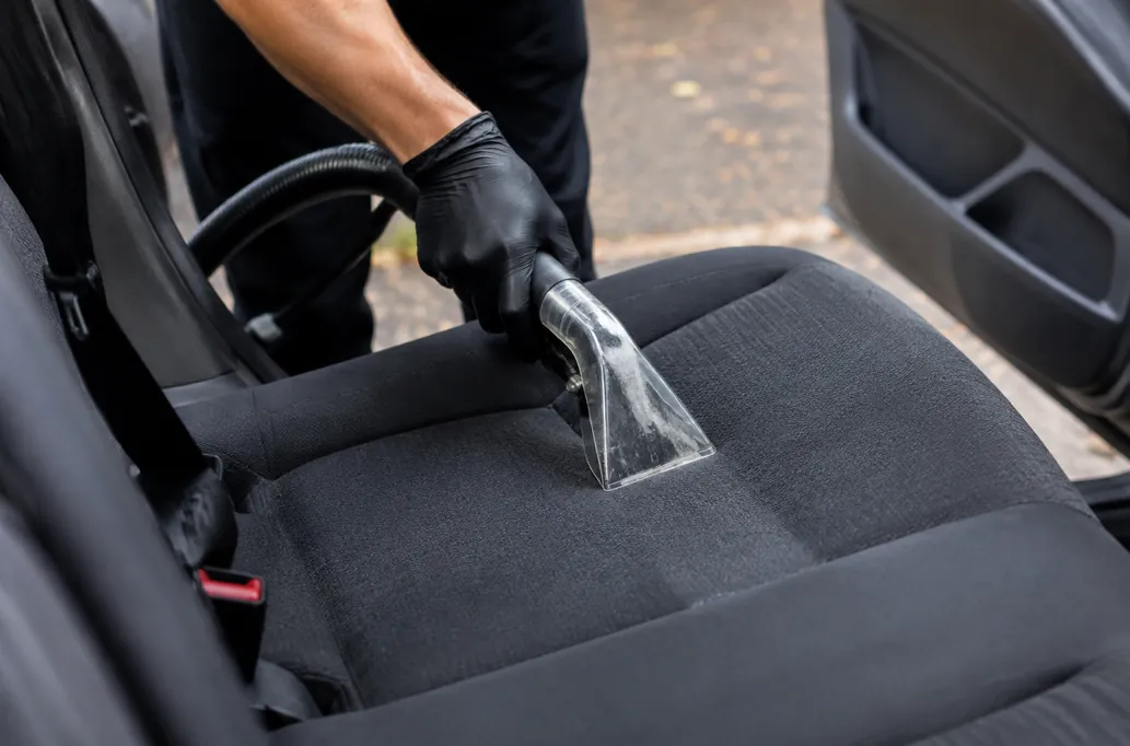 Upholstery extraction on a fabric car seat — illustrative detailing image
